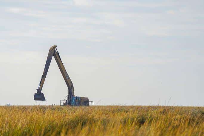 What Is a Digger Derrick and How Is It Used in Wetland Utility Work?