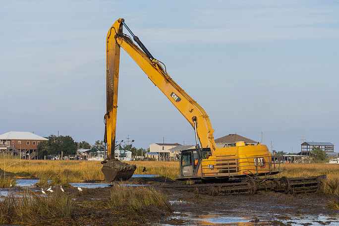How Does an Amphibious Excavator Work in Wetlands and Shallow Water?